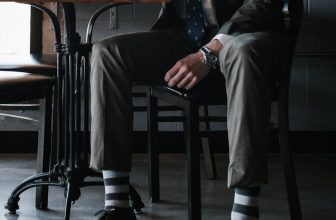 photo of man sitting on chair