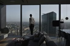 man in shirt in luxury apartment in city